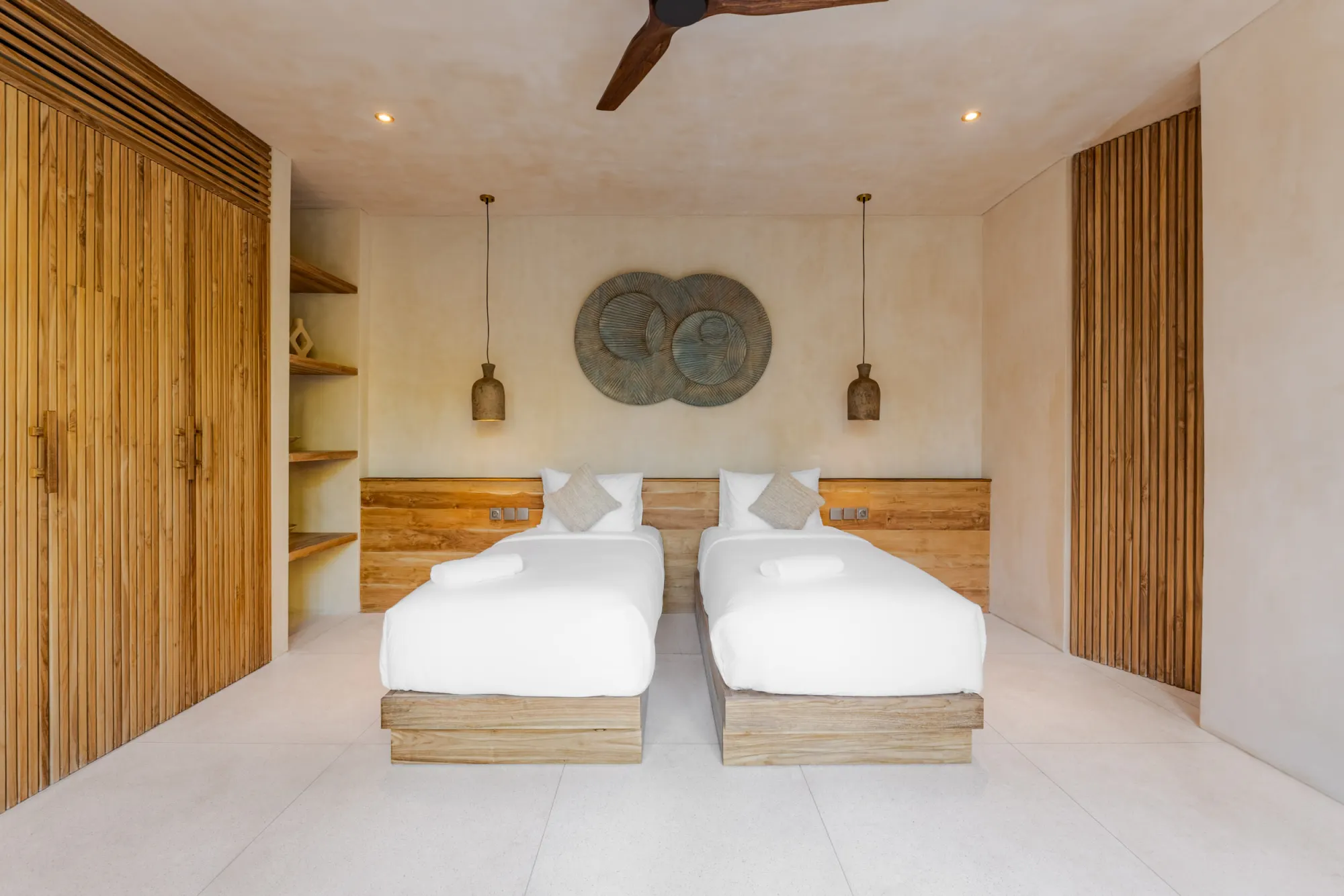 Twin-bed bedroom with pendant lighting and wooden features