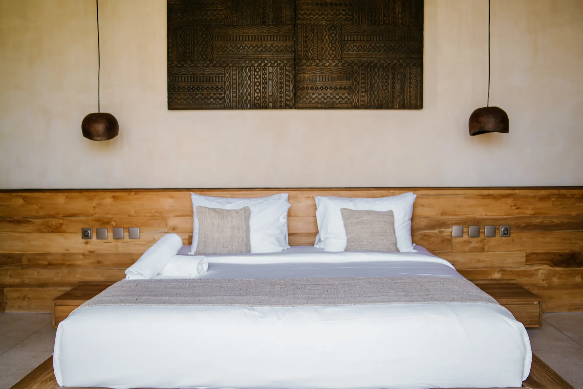 Bedroom overview with artistic wall installations