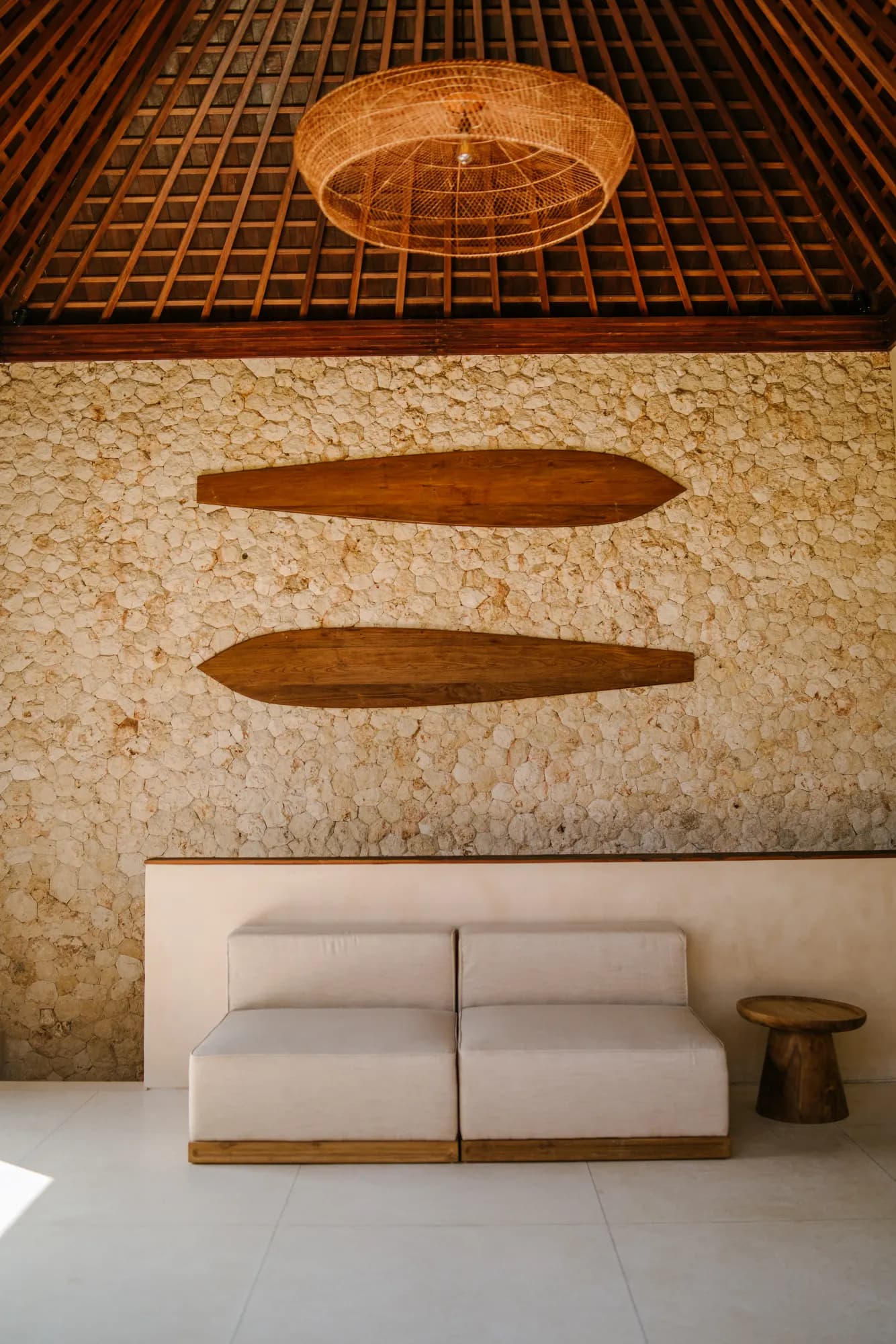 Living space with surfboard art and modern furniture