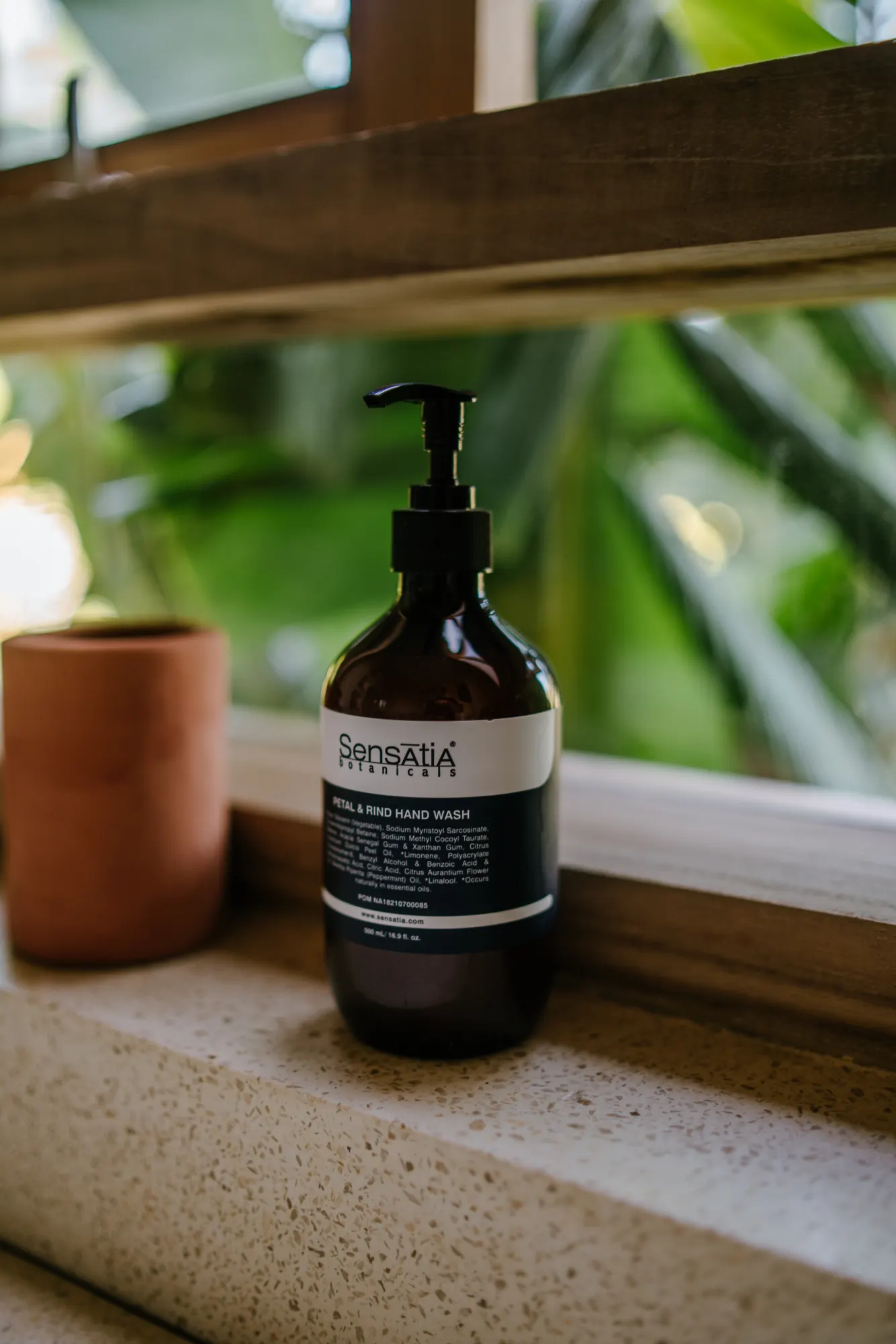 Hand soap dispenser on marble bathroom counter