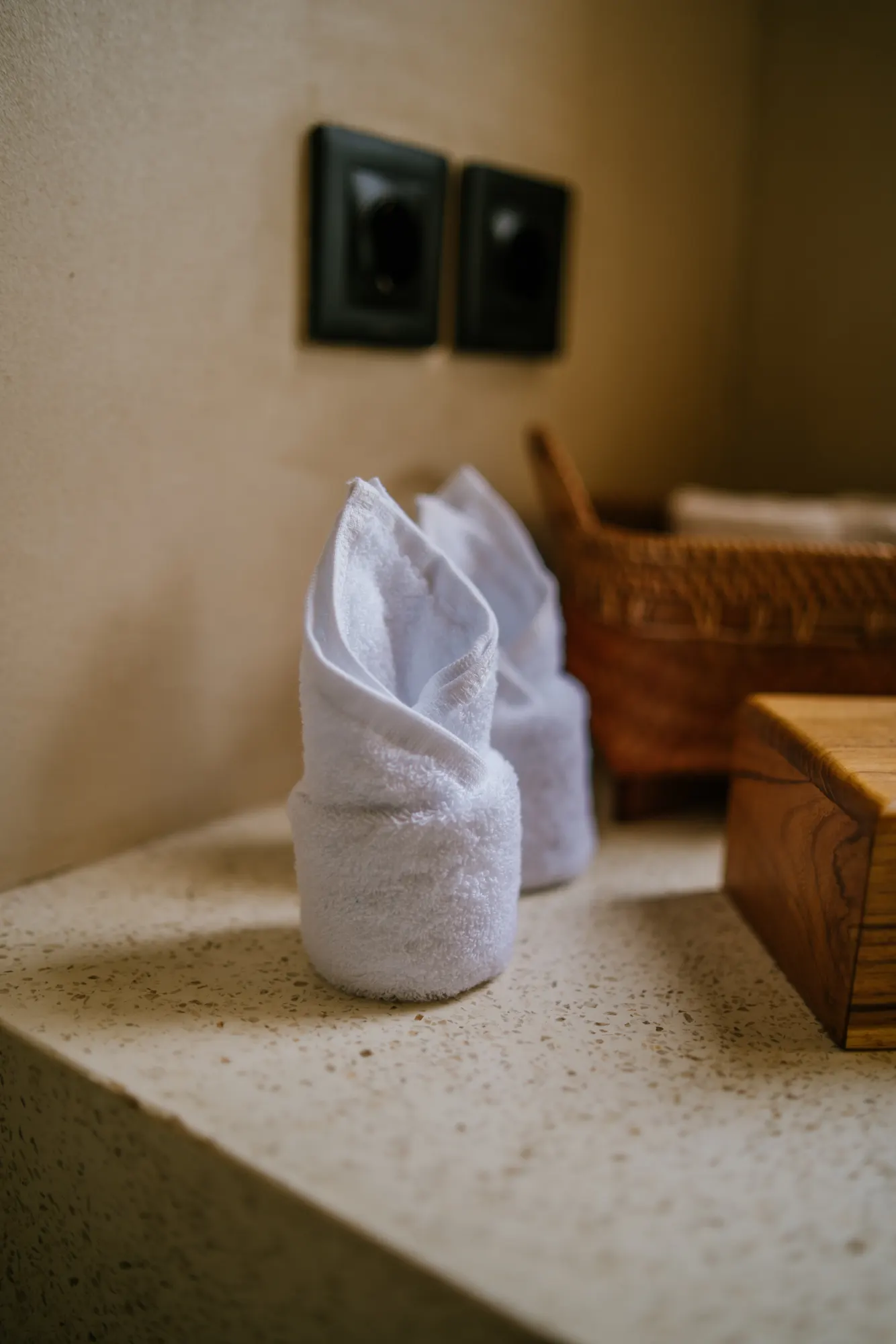 Folded towels on spa bathroom counter